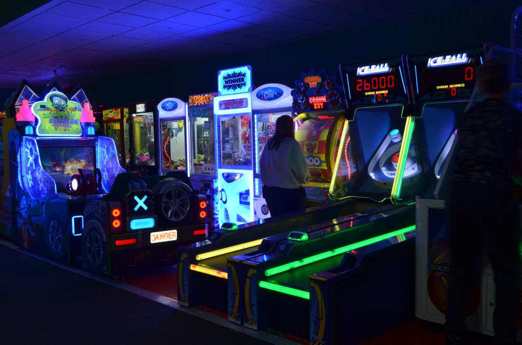 Neon-lit arcade games at Wyncity Bowl & Entertainment