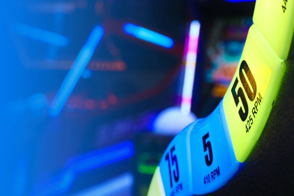 Neon-lit arcade game wheel at Fun Planet